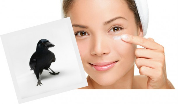 Everyone's favourite stock model applies eyecream while a crow looks on.  As they do.