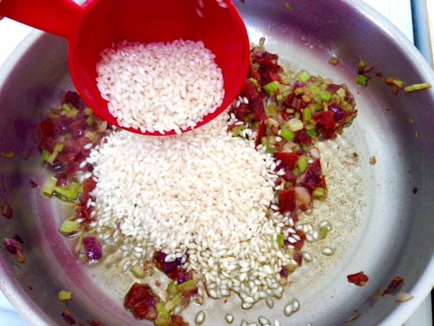 10. Adding rice to pan