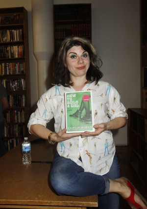 British writer Caitlin Moran who has been compared to US writer and actress Lena Dunham shocked her audience by pulling up her blouse and showing her huge belly fat and commenting on men's penis size during a reading of her book, 'How to Build a Girl' Featuring: Caitlin Moran Where: New York, New York, United States When: 07 Jul 2015 Credit: Michael Carpenter/WENN.com **Not available for New York Daily News.**