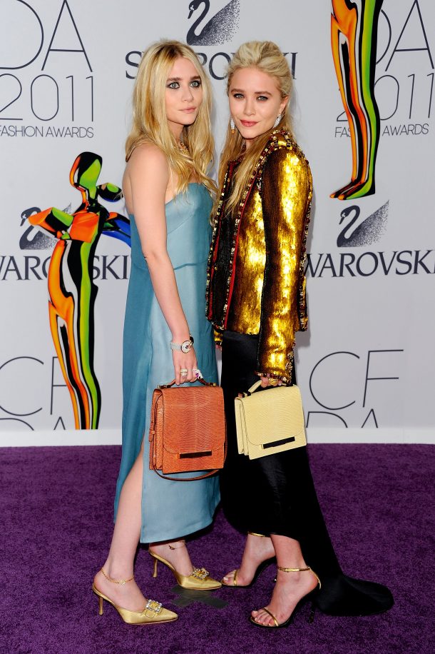NEW YORK, NY - JUNE 06: Designers Ashley Olsen (L) and Mary-Kate Olsen attend the 2011 CFDA Fashion Awards at Alice Tully Hall, Lincoln Center on June 6, 2011 in New York City. (Photo by Andrew H. Walker/Getty Images)