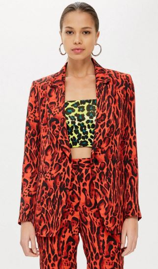 model wearing a red leopard print jacket