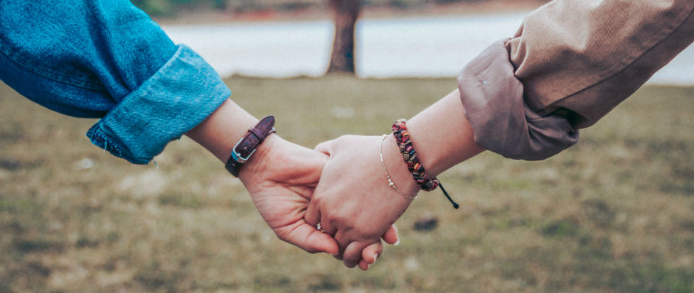 two people holding hands